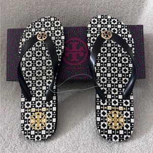 Tory Burch Black White and Gold logo flip flops